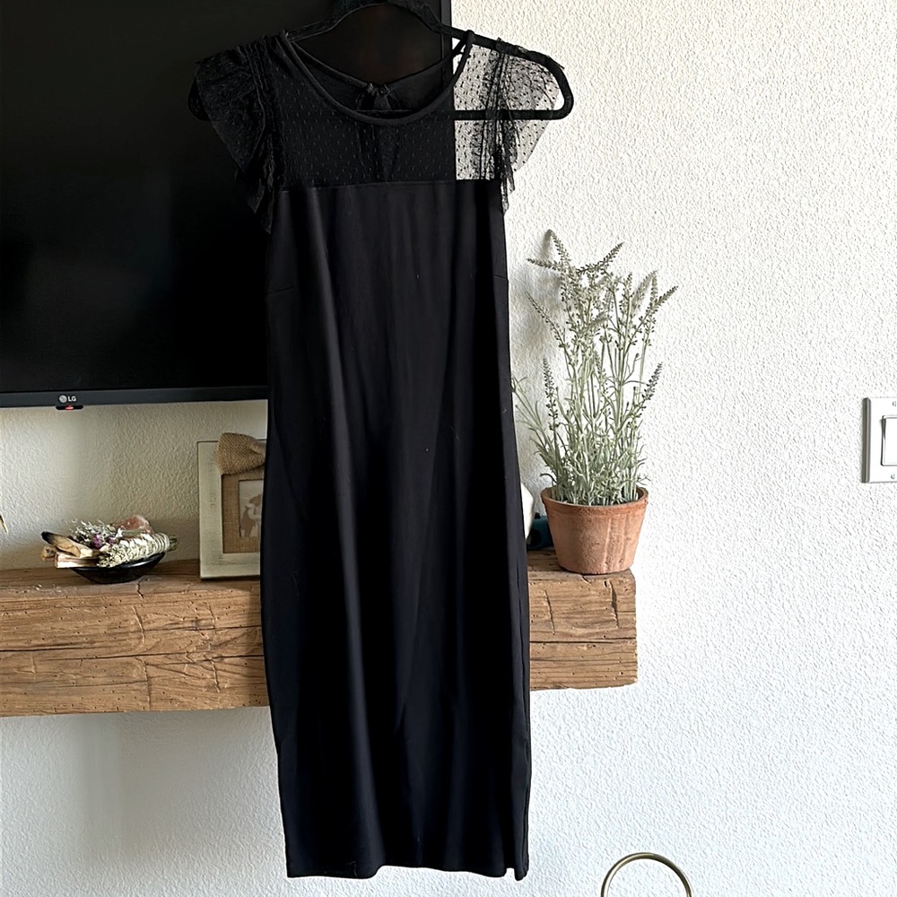 Red Valentino black dress with lace on the top.